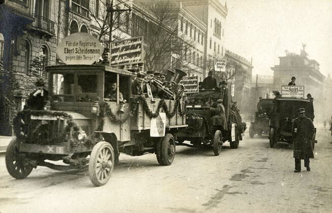 GERMAN REVOLUTION Paved trucks in Berlin carrying a marching band For the EBERT SCHEIDEMANN government against terror Anonymous photograph for a 1919 postcard Credit Collection IM KHARBINE TAPABOR  KH171508