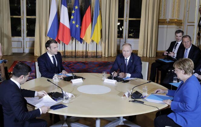 PARIS, FRANCE â€“ DECEMBER 9, 2019: Ukraine s President Volodymyr Zelenskyy (Vladimir Zelensky), France s President Emmanuel Macron, Russia s President Vladimir Putin, and Germany s Chancellor Angela Merkel (L-R seated) attend a Normandy Four summit in the Murat Lounge in the Elysee Palace; talks in the so-called Normandy Four format involve representatives of Ukraine, Germany, France and Russia who discuss settlement of the conflict in eastern Ukraine. Mikhail Metzel TASS  TS0C6B28
