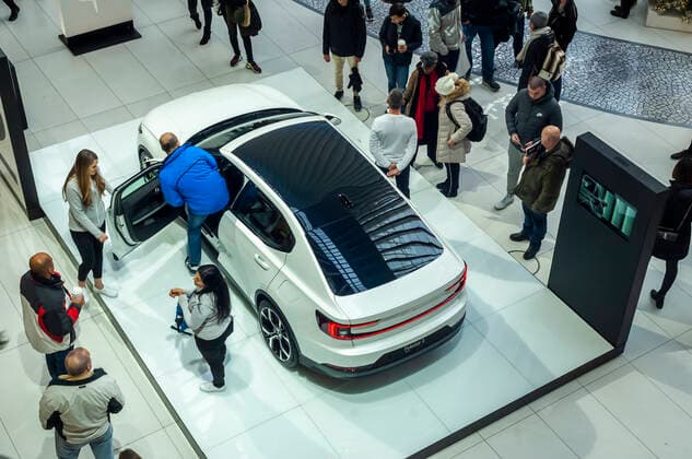 Polestar 2 electric vehicle Visitors ogle the Polestar 2 all-electric automobile on display in the World Trade Center Transportation Hub inNew York on Sunday, December 8, 2019. The Polestar 2, a brand of the Volvo Car Corp. will be manufactured in Luqiao, China. VolvoÕa parent company is the Chinese Zhejiang Geely Holding Group. The Swedish Volvo was bought by the Ford Motor Company and eventually sold to Geely Holding Group. (  RichardxB.xLevine