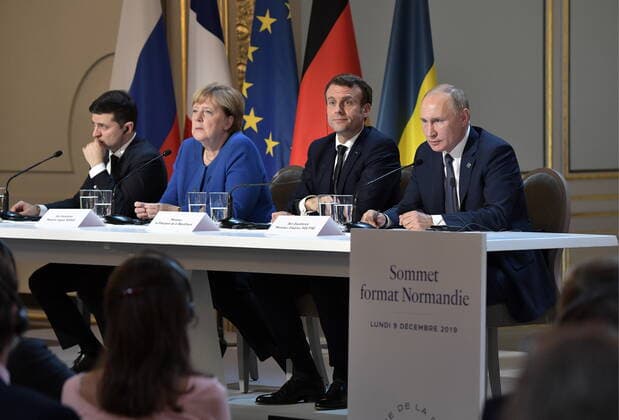 PARIS, FRANCE â€“ DECEMBER 9, 2019: Ukraine s President Volodymyr Zelenskyy (Vladimir Zelensky), Germany s Chancellor Angela Merkel, France s President Emmanuel Macron, and Russia s President Vladimir Putin (L-R) give a news conference after a Normandy Four summit at the Elysee Palace; talks in the so-called Normandy Four format involve representatives of Ukraine, Germany, France and Russia who discuss settlement of the conflict in eastern Ukraine. Alexei Nikolsky Russian Presidential Press and Information Office TASS  TS0C6BDB