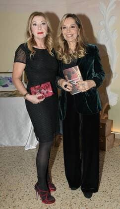 Milan, Italy AMAL event with Silvana Giacobini presenting her book, Daniela Cuzzolin Oberosler career award during the Christmas greetings cocktail In the photo: Silvana Giacobini, Daniela Cuzzolin Oberosler dress Giorgio Armani  Copyright: xNickxZonnax xIPAx xNickxZonnax