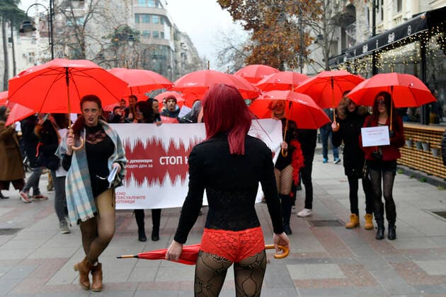 Prostitute protest - Skopje, Macedonia 17.12.2019., Skopje, Macedonia - Annual Mars of the Red Umbrellas held to promote the rights of sex workers in Macedonia. Girls with masks and red umbrellas marched and demand from state bodies to remove prejudice and condemnation and prevent violence against sex workers.  STR-1234 HaloPix PIXSELL