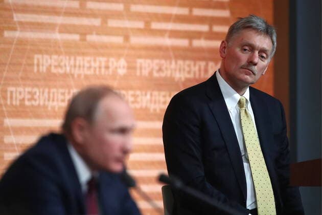MOSCOW, RUSSIA - DECEMBER 19, 2019: Russia s President Vladimir Putin (front) and his spokesman Dmitry Peskov give the 15th annual end-of-year news conference at the World Trade Centre. Valery Sharifulin TASS  TS0C7EA8