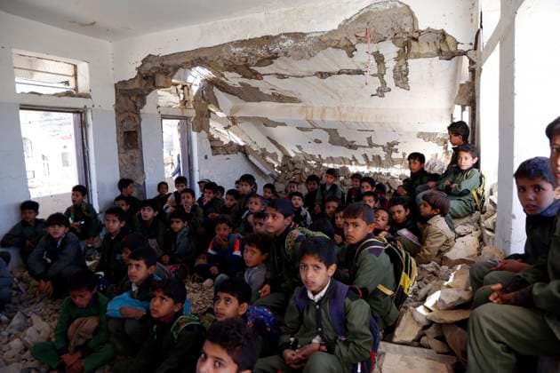 (191225) -- IBB, Dec. 25, 2019 (Xinhua) -- Students have a class in the Shuhada-Alwahdah School in Al-Radhmah district in Ibb province, Yemen, Dec. 23, 2019. The war in Yemen has forced more than two million children out of school and put 3.7 million others at high risk because of the non-payment of teachers salaries, according to the United Nations Children s Fund (UNICEF). But for those who can return, they will risk everything in order to go back to the classrooms, even to sit on the rubble of airstrike-hit schools. TO GO WITH Feature: Yemeni students return to airstrike-hit school (Photo by Mohammed Mohammed Xinhua) YEMEN-AIRSTRIKE-HIT SCHOOLS-STUDENTS 