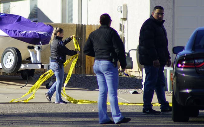 December 26, 2019, Albuquerque, NEW MEXICO, USA: 122619 .Rio Rancho Police Officers remove crime tape while investigating after 4 people were found shot on Christmas Day at a home located in Northern Meadows .Photographed on Thursday December 26, 2019. JOURNAL Albuquerque USA - ZUMAab1_ 20191226_zaf_ab1_007 Copyright: xAdolphexPierre-Louisx