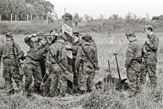 GDR border soldiers erecting a border post to mark the border to the Federal Republic of Germany in the Buestedt district of Helmstdet on 10 10 1967