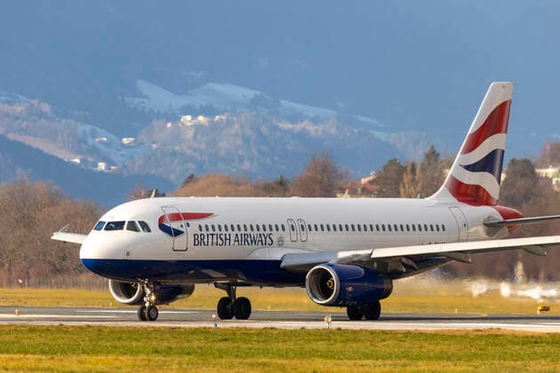 AUT, Austria, Austria, Innsbruck, 29 12 2019 Airport Innsbruck Kranebitten, INN, LOWI Aircraft on approach from snow-covered mountains Registration G EUYC, British Airways, Airbus A320 200, BA, BAW, XMS