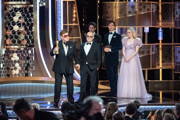 Elton John and Bernie Taupin accept the Golden Globe Award for Best Original Song - Motion Picture for Rocketman from presenters, Ansel Elgort and Dakota Fanning at the 77th Annual Golden Globe Awards at the Beverly Hilton in Beverly Hills, CA on Sunday, January 5, 2020.  Copyright: xHFPAxPhotographerx 33938-283PLX