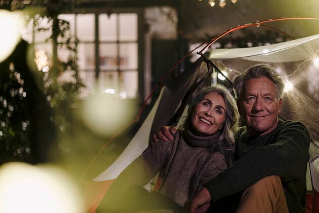 Happy senior couple camping in garden of their home at night model released Symbolfoto property released  GUSF03099