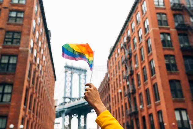 Creative Highlights Symbolfotos Hand waving LGBT flag in NYC, USA model released Symbolfoto  JCMF00293