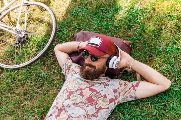 Mature man with red basecap, sunglasses and white headphones model released Symbolfoto  TCF06227