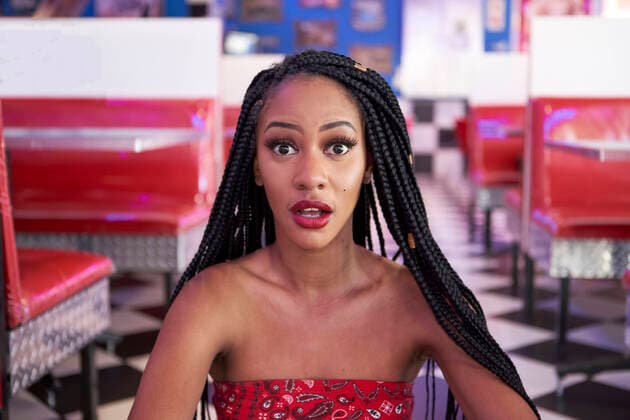 Creative Highlights Symbolfotos Portrait of a young woman with braided hairstyle in an american diner restaurant model released Symbolfoto property released  VEGF01197