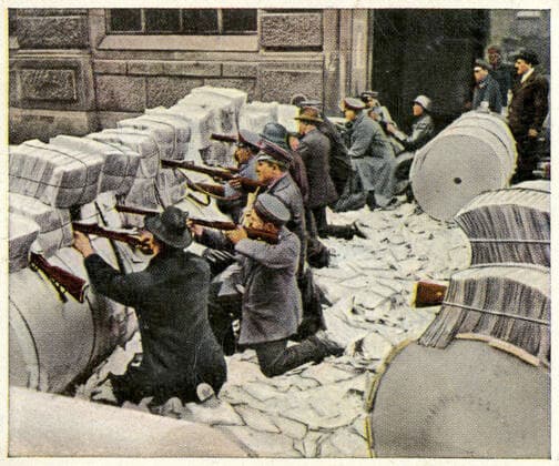 GERMANY 1919 January 1919 barricade during street fighting in Berlin spartakist revolution during a street fight the fighters protect themselves behind a barricade made of rolls of paper and stacks of newspapers The scene takes place in front of the VORWATS building, official SPD organ, blocked by insurgents for publishing articles h  KH181530