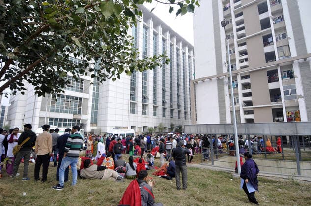 NOIDA, INDIA - JANUARY 9: Hospital patients, medical staff and visitors at the compund grounds after being evacuated from a fire incident in the basement of ESIC Hospital at Sector 24 on January 9, 2020 in Noida, India. (Photo by Sunil Ghosh Hindustan Times) Fire At Noida ESIC Hospital