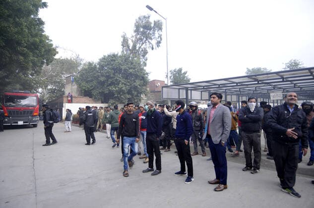 NOIDA, INDIA - JANUARY 9: Hospital patients, medical staff and visitors at the compund grounds after being evacuated from a fire incident in the basement of ESIC Hospital at Sector 24 on January 9, 2020 in Noida, India. (Photo by Sunil Ghosh Hindustan Times) Fire At Noida ESIC Hospital