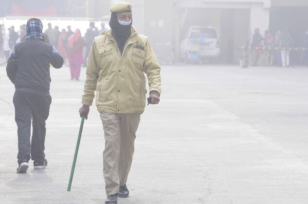 NOIDA, INDIA - JANUARY 9: A police personnel gives directions during a fire incident in the basement of ESIC Hospital at Sector 24 on January 9, 2020 in Noida, India. (Photo by Sunil Ghosh Hindustan Times) Fire At Noida ESIC Hospital