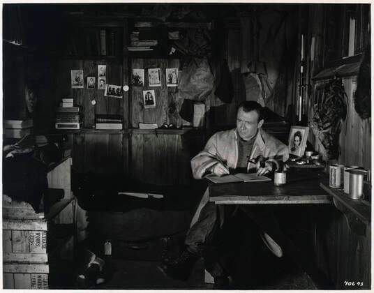 SOUTH POLE Scott writing his logbook Photograph of the film Scott of the Antartic L aventure sans retour made in 1948 by Charles FREND 1909 1977 with John MILLS 1908 2005 after the exploration trip to the South Pole by SCOTT 1868 1912 Credit Collection Jonas Kharbine Tapabor  KH254207