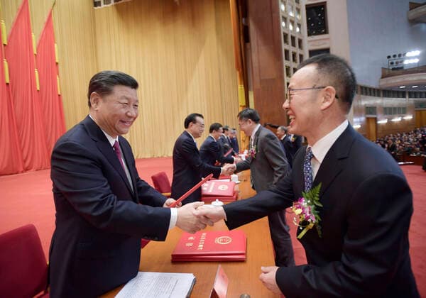 (200110) -- BEIJING, Jan. 10, 2020 -- Chinese President Xi Jinping, also general secretary of the Communist Party of China (CPC) Central Committee and chairman of the Central Military Commission, other leaders and China s top science award winners Huang Xuhua and Zeng Qingcun, present certificates to representatives of the winners of the State Natural Science Award, the State Technological Invention Award, the State Scientific and Technological Progress Award, and the International Science and Technology Cooperation Award during an annual ceremony to honor distinguished scientists, engineers and research achievements at the Great Hall of the People in Beijing, capital of China, Jan. 10, 2020. Huang Xuhua is an academician of the Chinese Academy of Engineering who worked at a research institute of the former China Shipbuilding Industry Co