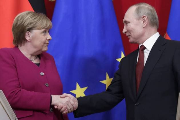 MOSCOW, RUSSIA - JANUARY 11, 2020: Germany s Chancellor Angela Merkel (L) and Russia s President Vladimir Putin shake hands during a joint news conference after a meeting at the Moscow Kremlin. Mikhail Metzel TASS  TS0C9E08