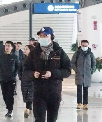 Coronavirus outbreak in China People wearing masks are seen at an airport in Wuhan, China, on Jan. 17, 2020. Local authorities said the same day that a second person died in the city of pneumonia caused by a new coronavirus. 