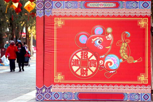 Chinese walk through a decorated a park for the upcoming Chinese New Year celebrating the Year of the Rat in Beijing on Saturday, January 18, 2020. The Year of the Rat is traditionally the most unfortunate, laden with bad omens and mishaps - this as China s economic growth hits a three-decade low, a new coronavirus outbreak, a trade war and and pork output plunging to a 16-year low.  PEK2020011803 STEPHENxSHAVER