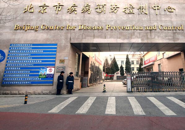 Chinese security guards stand outside the capital s center for disease control, prevention and research in central Beijing on Tuesday, January 21, 2020. Health authorities in China reported the country s fourth death from a new type of coronavirus, as the country braces for the Lunar New Year travel boom amid concerns over a possible outbreak similar to that of the SARS virus in the early 2000s.  PEK2020012104 STEPHENxSHAVER