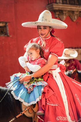 January 21, 2020, San Miguel De Allende, Guanajuato, Mexico: A Mexican Cowgirl and her daughter ride horseback in a parade to celebrate the 251st birthday of the Mexican Independence hero Ignacio Allende January 21, 2020 in San Miguel de Allende, Guanajuato, Mexico. Allende, from a wealthy family in San Miguel played a major role in the independency war against Spain in 1810 and later honored by his home city by adding his name. San Miguel De Allende Mexico - ZUMAe02_ 20200121_zaf_e02_021 Copyright: xRichardxEllisx