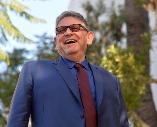 Sir Lucian Grainge (C), chairman and chief executive officer of Universal Music Group reacts to comments by singer Lionel Richie during an unveiling ceremony honoring him with the 2,685th star on the Hollywood Walk of Fame on Thursday, January 23, 2020 in Los Angeles.  LAP2020012319 JIMxRUYMEN