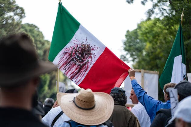 January 23, 2020, Cuernavaca, Mexico: Members of the LeBaron family hold up a flag that has been graffiti with blood lines during a march for peace..Hundreds of people took part during the March for peace from Cuernavaca along the road to Mexico City. Among the protesters were several members of the LeBaron family marching for the missing 43 students and others hoping for peace in Mexico. Cuernavaca Mexico - ZUMAs197 20200123_zaa_s197_213 Copyright: xLexiexHarrison-Crippsx