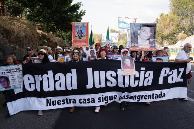 January 23, 2020, Cuernavaca, Mexico: Protesters hold a banner and placards during a march for peace..Hundreds of people took part during the March for peace from Cuernavaca along the road to Mexico City. Among the protesters were several members of the LeBaron family marching for the missing 43 students and others hoping for peace in Mexico. Cuernavaca Mexico - ZUMAs197 20200123_zaa_s197_218 Copyright: xLexiexHarrison-Crippsx
