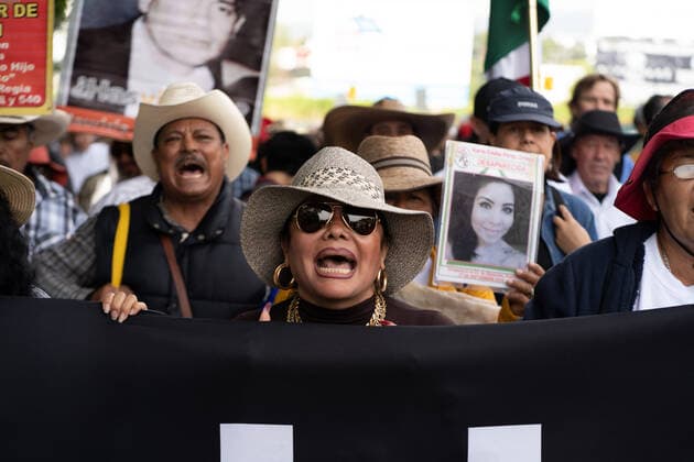 January 23, 2020, Cuernavaca, Mexico: A woman chants slogans during a march for peace..Hundreds of people took part during the March for peace from Cuernavaca along the road to Mexico City. Among the protesters were several members of the LeBaron family marching for the missing 43 students and others hoping for peace in Mexico. Cuernavaca Mexico - ZUMAs197 20200123_zaa_s197_244 Copyright: xLexiexHarrison-Crippsx