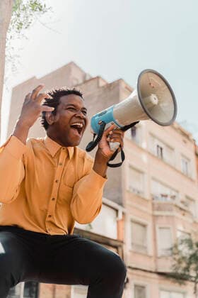 Mature man using megaphone and screaming model released Symbolfoto  AFVF05006