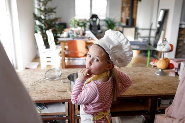 Girl wearing chef s hat in the kitchen model released Symbolfoto property released  KMKF01165