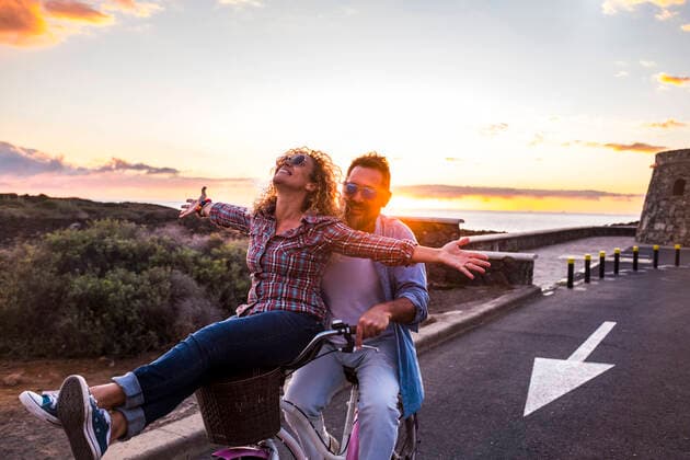 Smiling couple on bicycle, Tenerife, Spain model released Symbolfoto  SIPF02100