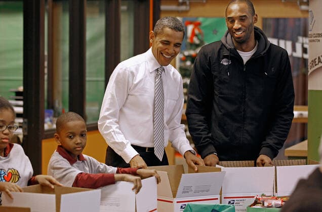 December 13, 2010, Washington, District of Columbia, USA: United States President Barack Obama (C) and Los Angeles Lakers guard Kobe Bryant help children volunteers fill care packages during a NBA Cares service event at the Boys and Girls Club at THEARC, December 13, 2010 in Washington, DC. Bryant and all the members of the 2010 NBA Championship Lakers team volunteered on projects at the club before being honored by the president for their victory. .Credit: - Pool via CNP Washington USA - ZUMAs152 20101213_zaa_s152_005 Copyright: xChipxSomodevillax