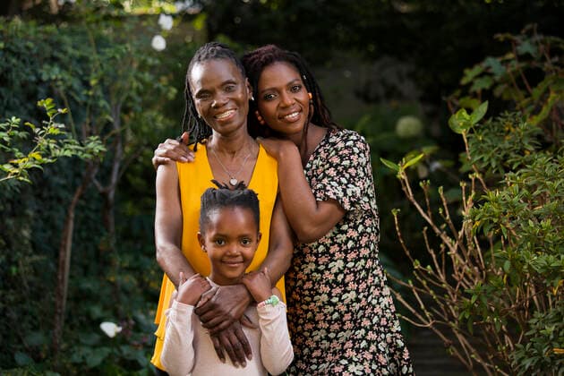 A grandmother, mother, and daughter standing together in a garden  Copyright: xGreatstockx PE-012-0505G