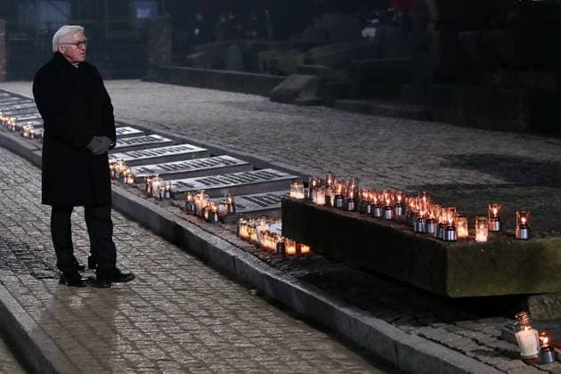 OSWIECIM, POLAND - JANUARY 27, 2020: Germany s President Frank-Walter Steinmeier at a candle laying ceremony during events commemorating the 75th anniversary of liberation of the former Auschwitz concentration camp operated by Nazi Germany during WWII, by the Soviet Red Army. Over a million Jews, as well as Soviet and Polish prisoners, were killed in the camp s gas chambers to be burnt in crematoria. Auschwitz was liberated by the Soviet Red Army on 27 January 1945; in 1947, the Polish government founded the Auschwitz-Birkenau State Museum on the site of the camp, which in 1979 was inscribed on the UNESCO World Heritage Site List. In 2005, January 27 was named International Holocaust Remembrance Day by the General Assembly of the United Nations. Natalia Fedosenko TASS  TS0CBF70