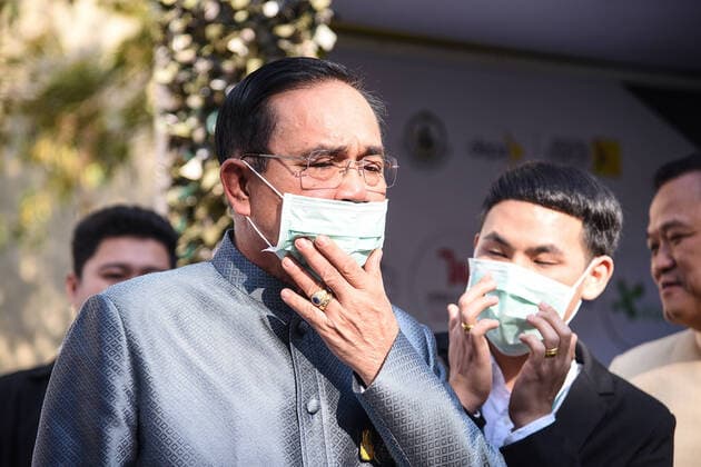 Thailand: Thai PM Prayuth Chan-ocha wears mask Thai Prime Minister Prayuth Chan-ocha demonstration of wearing mask at Government House in Bangkok Thailand during watch out for the spread of disease from a new strain of corona virus. Thailand VichanxPoti