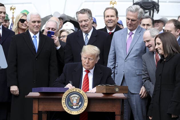 President Donald Trump signs a United States-Mexico-Canada Trade Agreement on the South Lawn of the White House during a ceremony on January 29, 2020 in Washington, DC.  WAX20200129102 OliverxContreras