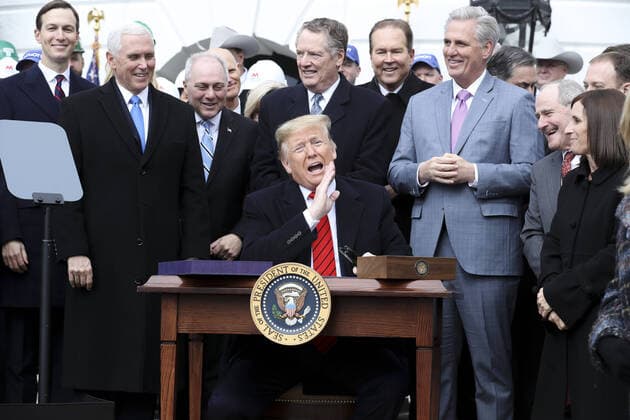 President Donald Trump reacts after signing a United States-Mexico-Canada Trade Agreement on the South Lawn of the White House during a ceremony on January 29, 2020 in Washington, DC.  WAX20200129104 OliverxContreras