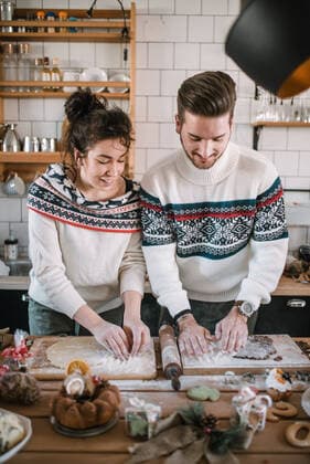 Friends in Christmas sweater make dough in the kitchen. Å½drelo, BraniÄevo District, Serbia CR_NEST200106-270717-01