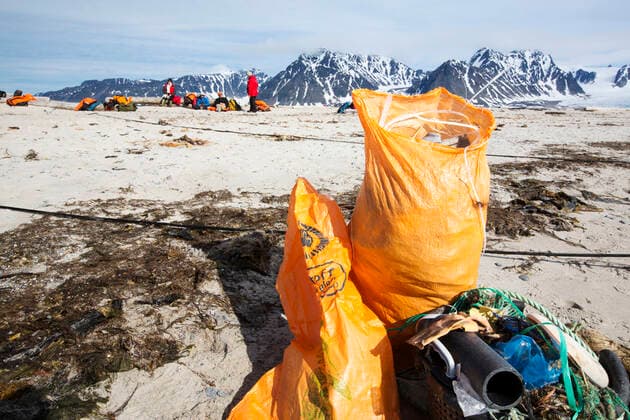 Tourists collect plastic rubbish on a remote beach in Northern Svalbard, only about 600 miles from the North Pole. The plastic has been washed ashore by ocean currents. SvalbarÃ°shreppur, Iceland ,editorial use only CR_OQMH191212B-262537-01