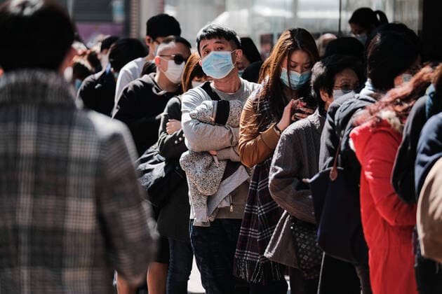 January 30, 2020, Hong Kong, China: Hundreds of people wait in a queue to buy surgical masks at a Bonjour Cosmetics store. .As coronavirus spreads, the World Health Organization will hold an emergency meeting on Thursday as officials consider whether to declare a public health emergency. Hong Kong China - ZUMAs197 20200130_zaa_s197_146 Copyright: xKeithxTsujix