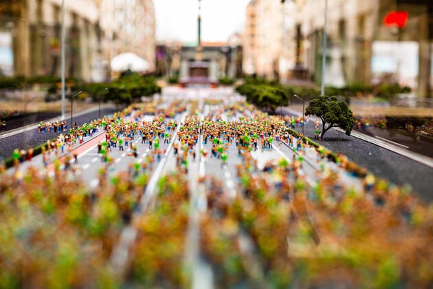 Miniature model of the Loveparade Rave the Planet, In the Mall of Berlin is the Straße des 17 Juni in scale 1 87, by Ernst Reuter Platz above the Victory Column The street is filled with hundreds of miniature figures With a donation you can become part of ravetheplanet A miniature figure stands symbolically for a donor An action with which the founder of the Loveparade wants to start