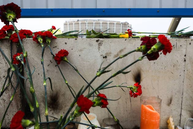 ST PETERSBURG, RUSSIA - FEBRUARY 1, 2020: Candles and flowers in memory of a worker who died in a partial collapse of the Saint Petersburg Sports and Concert Complex. According to preliminary estimates, the collapse area amounts to 28,000 square meters which comprises about 80% of walls and roof structures. Roman Pimenov TASS  TS0CC8EC