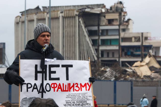 ST PETERSBURG, RUSSIA - FEBRUARY 2, 2020: A demonstrator holds a sign with a message reading No to Fascist Urban Planning! as he addresses a protest against the ongoing dismantling of St Petersburg Sports and Concert Complex (also known as SKK); the protesters demanded that the building be restored and called for an investigation in connection with the death of a worker who died 31 January 2020 in a roof collapse at the site of the sports centre. Roman Pimenov TASS  TS0CCA62