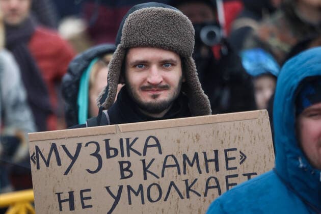 ST PETERSBURG, RUSSIA - FEBRUARY 2, 2020: A demonstrator holds a sign with a message reading Music in stone never falls silent during a protest against the ongoing dismantling of St Petersburg Sports and Concert Complex (also known as SKK); the protesters demanded that the building be restored and called for an investigation in connection with the death of a worker who died 31 January 2020 in a roof collapse at the site of the sports centre. Roman Pimenov TASS  TS0CCA6E