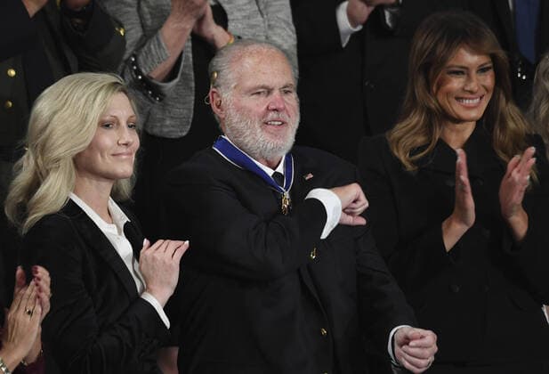 First Lady Melania Trump applauds after presenting the Presidential Medal of Freedom to conservative commentator Rush Limbaugh as President Donald Trump delivers his State of the Union address to a joint session of Congress in the House Chamber of the U.S. Capitol in Washington, DC on Tuesday, February 4, 2020.  WAP20200204165 PATxBENIC