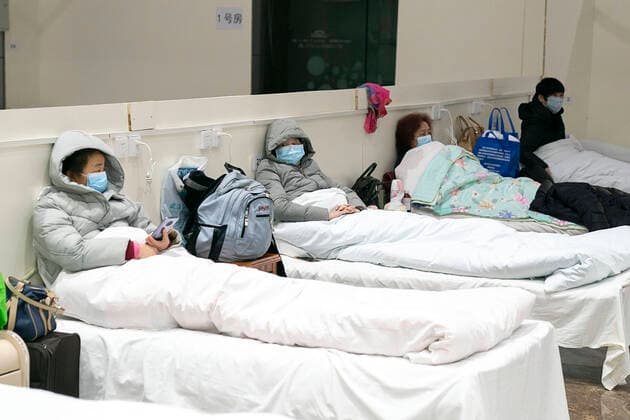 (200205) -- WUHAN, Feb. 5, 2020 -- Patients infected with the novel coronavirus are seen at a makeshift hospital converted from an exhibition center in Wuhan, central China s Hubei Province, Feb. 5, 2020. The first makeshift hospital converted from an exhibition center in China s epidemic-hit Wuhan city began accepting patients Wednesday. The hospital can provide about 1,600 beds to infected patients. ) CHINA-HUBEI-WUHAN-MAKESHIFT HOSPITAL-PATIENTS (CN) XiongxQi 
