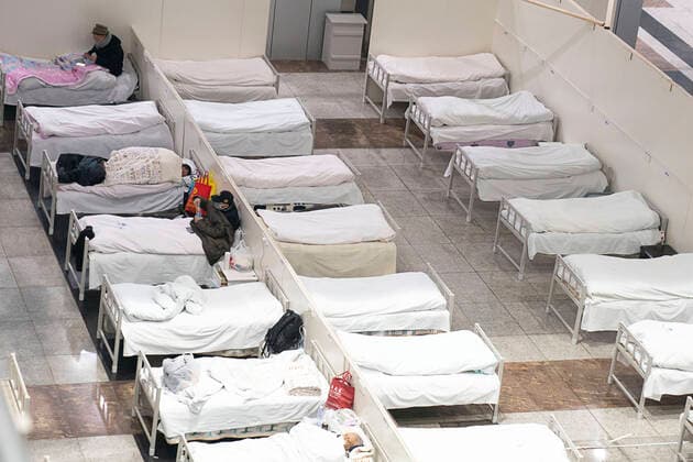 (200205) -- WUHAN, Feb. 5, 2020 -- Patients infected with the novel coronavirus are seen at a makeshift hospital converted from an exhibition center in Wuhan, central China s Hubei Province, Feb. 5, 2020. The first makeshift hospital converted from an exhibition center in China s epidemic-hit Wuhan city began accepting patients Wednesday. The hospital can provide about 1,600 beds to infected patients. ) CHINA-HUBEI-WUHAN-MAKESHIFT HOSPITAL-PATIENTS (CN) XiongxQi 
